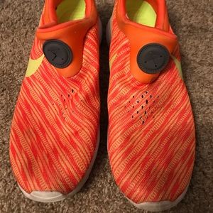 Orange Nike shoes